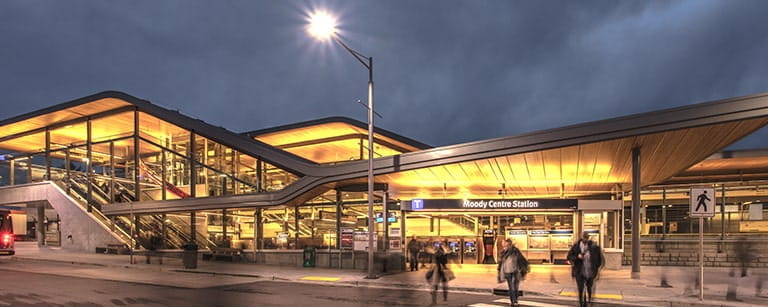 A SkyTrain station lit up at night