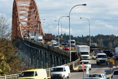 Many cars driving across the Patullo bridge