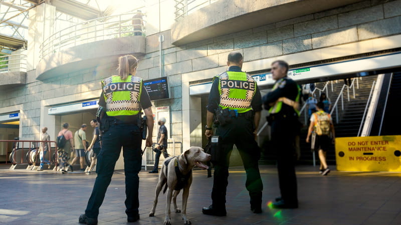 Three transit police officers at the SkyTrain station